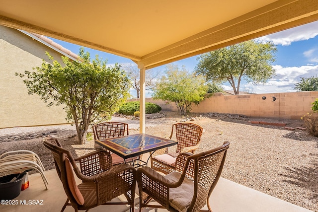 view of patio / terrace with outdoor dining space and a fenced backyard