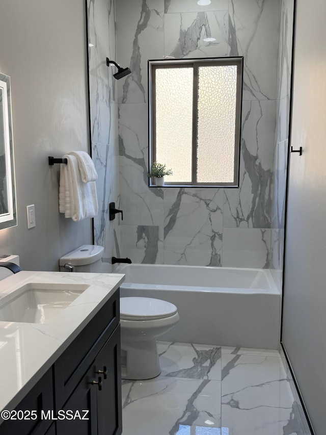 full bath featuring washtub / shower combination, toilet, marble finish floor, and vanity