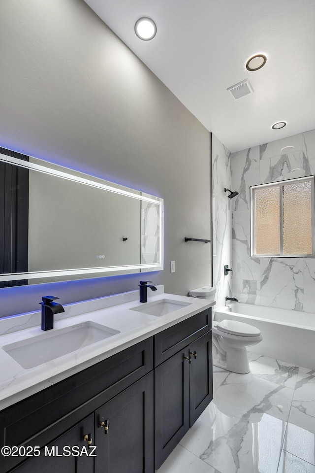 bathroom with double vanity, a sink, and marble finish floor