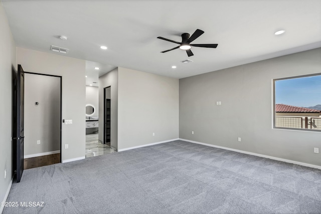 spare room featuring visible vents, recessed lighting, carpet, baseboards, and ceiling fan