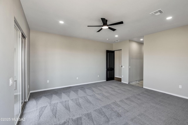 carpeted spare room with visible vents, a ceiling fan, baseboards, and recessed lighting