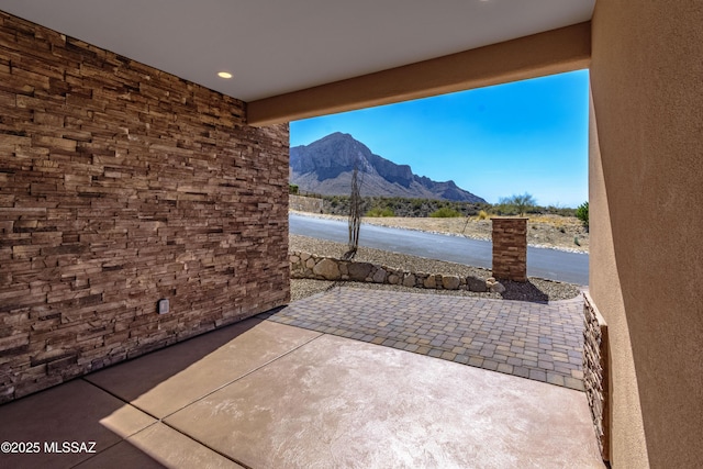 view of patio / terrace with a mountain view