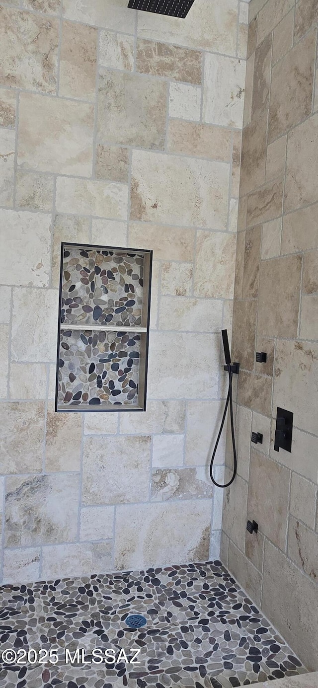 interior space with a tile shower