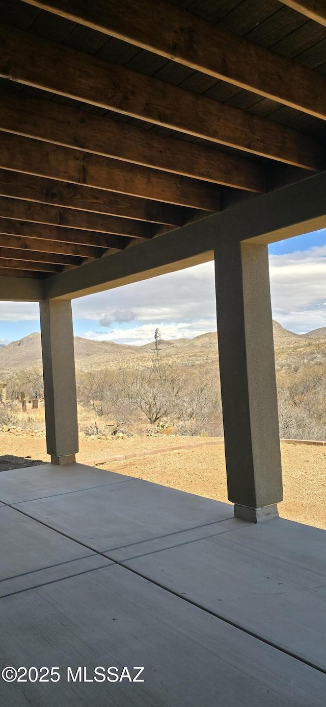 view of patio / terrace with a mountain view