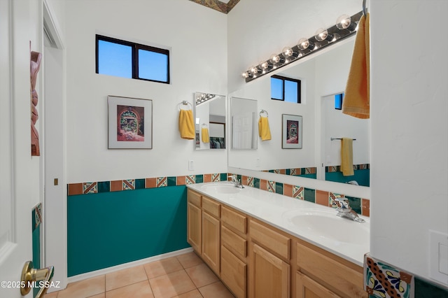 bathroom featuring plenty of natural light, tile patterned flooring, and a sink