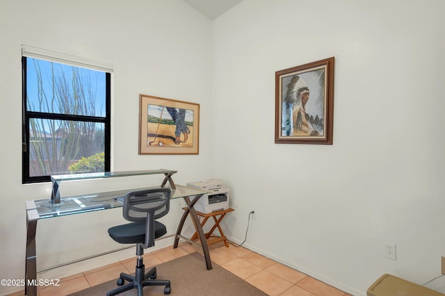 home office with baseboards and light tile patterned floors