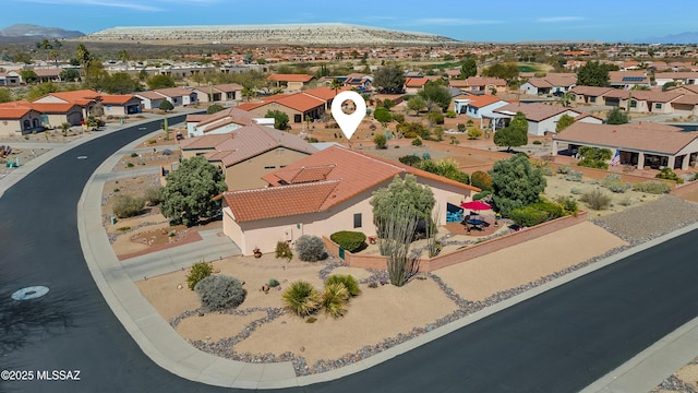 drone / aerial view featuring a mountain view and a residential view