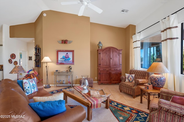 living room with light tile patterned floors, lofted ceiling, visible vents, and a ceiling fan