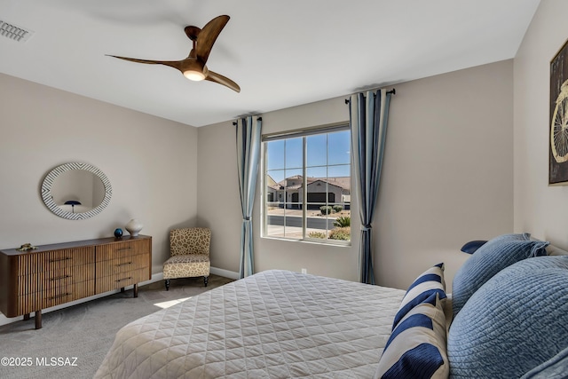 bedroom with visible vents, baseboards, a ceiling fan, and carpet floors