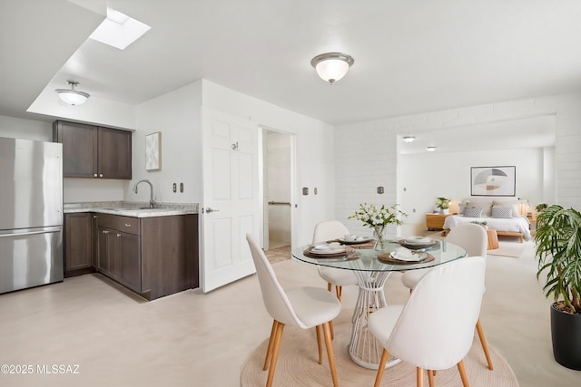 dining area featuring a skylight