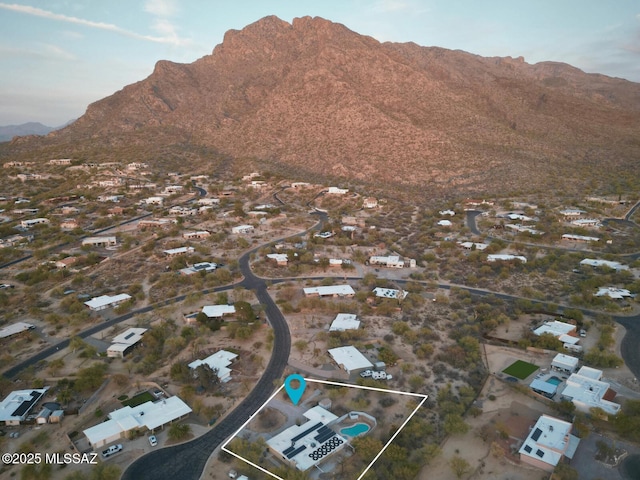 birds eye view of property featuring a mountain view