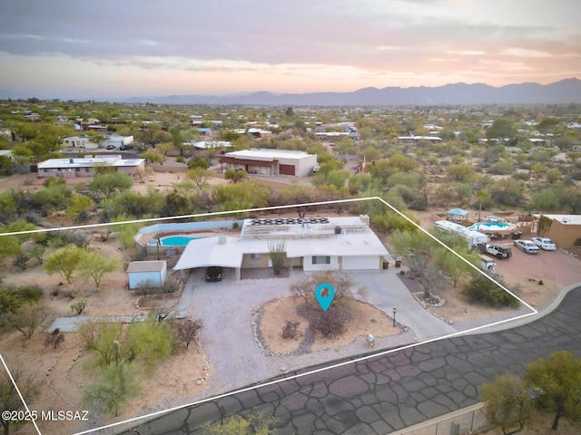 aerial view at dusk with a mountain view