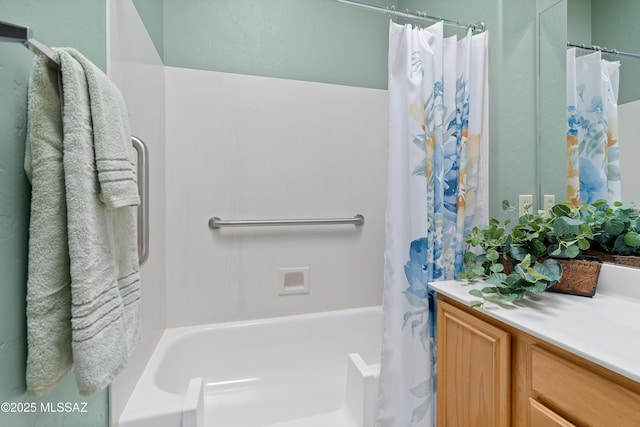 bathroom featuring vanity and shower / tub combo