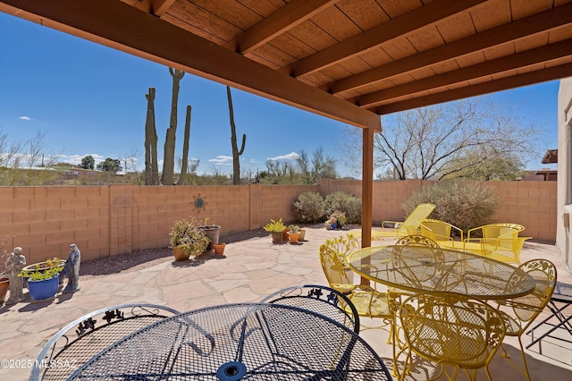 view of patio / terrace featuring outdoor dining area and a fenced backyard