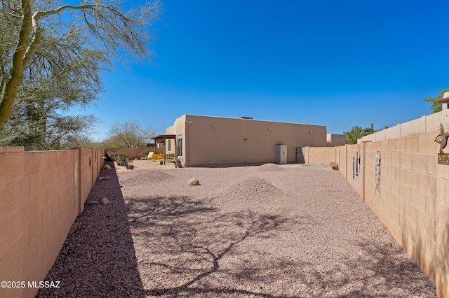 view of yard with a fenced backyard and a patio area