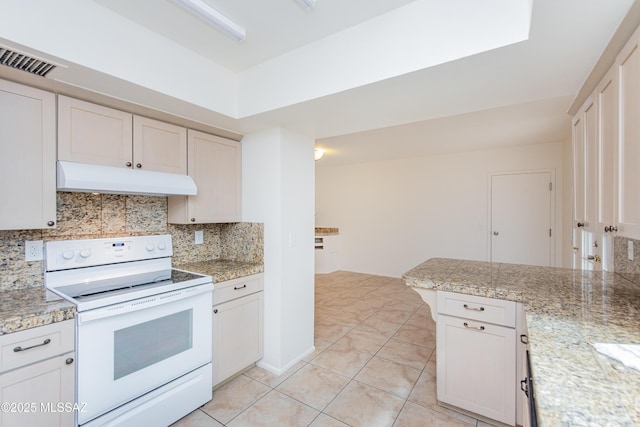 kitchen with electric range, visible vents, under cabinet range hood, backsplash, and light tile patterned flooring