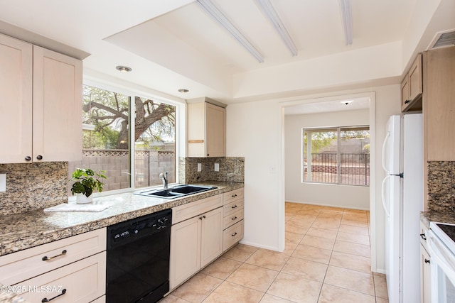 kitchen with visible vents, a sink, backsplash, white appliances, and light tile patterned floors