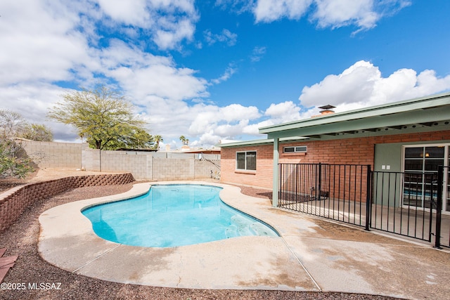 view of swimming pool featuring a patio, a fenced backyard, and a fenced in pool