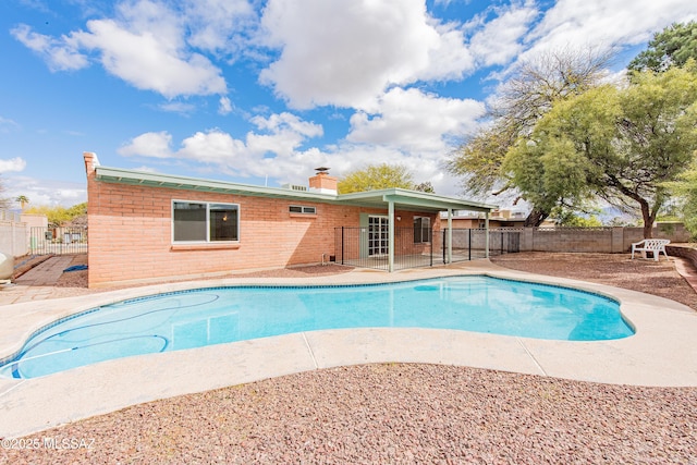 view of pool featuring a fenced in pool, a fenced backyard, and a patio area