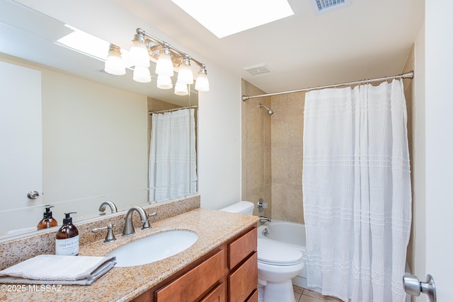 bathroom featuring tile patterned floors, visible vents, toilet, and vanity