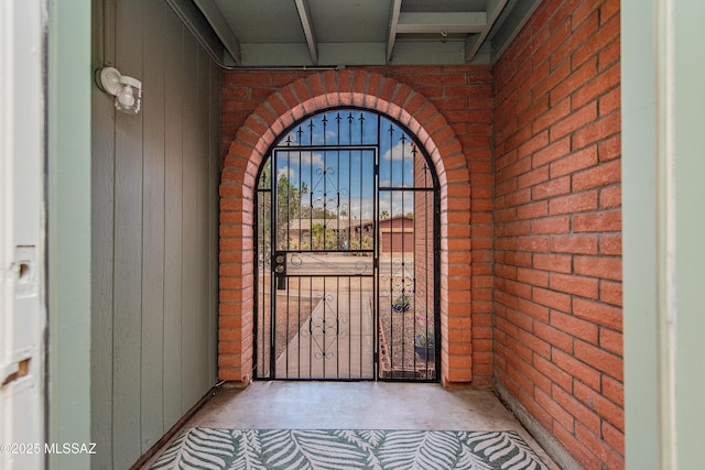 property entrance with brick siding