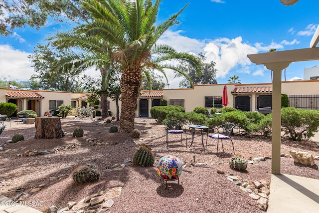 exterior space featuring a patio and stucco siding