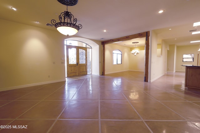 tiled foyer entrance with baseboards, an inviting chandelier, visible vents, and recessed lighting