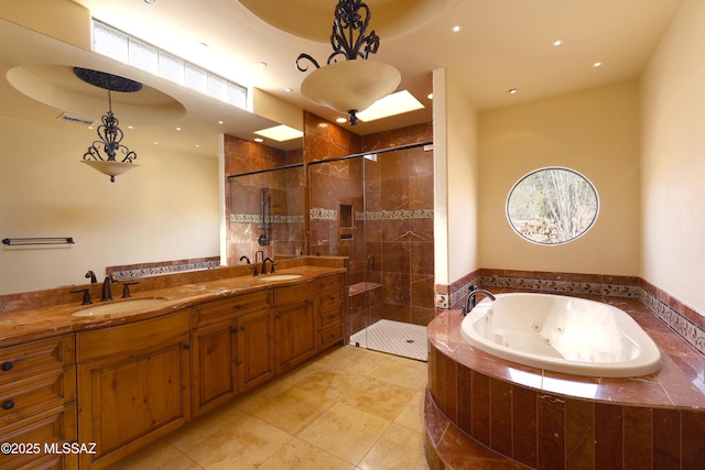 full bath with double vanity, visible vents, a stall shower, a sink, and a whirlpool tub