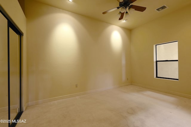 spare room featuring recessed lighting, light colored carpet, visible vents, a ceiling fan, and baseboards