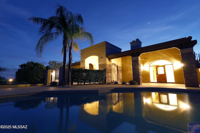 view of swimming pool featuring fence and a fenced in pool