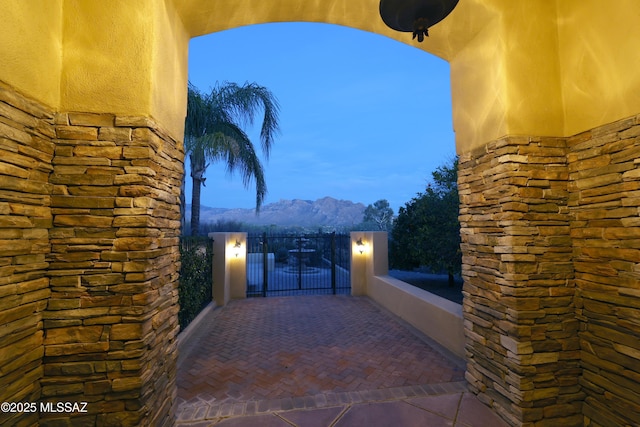 view of patio featuring a balcony