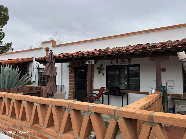 view of front of home with a tiled roof