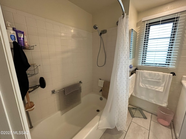 full bath featuring shower / bath combination with curtain and tile patterned floors