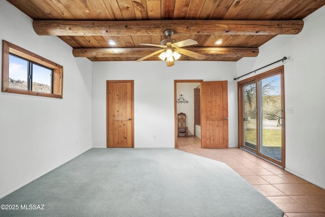 unfurnished bedroom featuring light tile patterned floors, light colored carpet, wood ceiling, access to outside, and beam ceiling