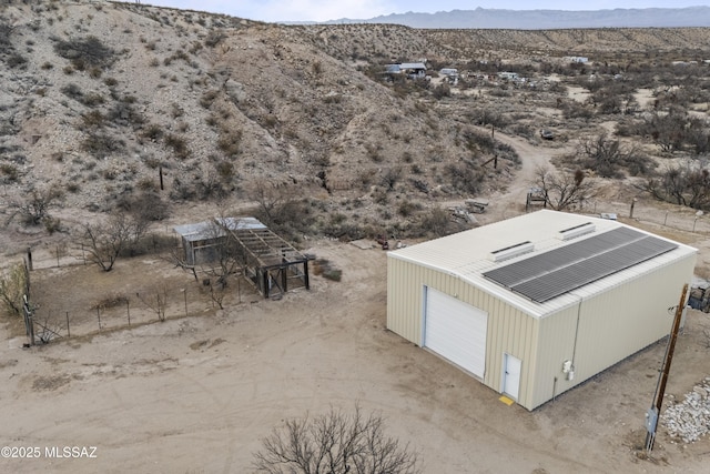 birds eye view of property featuring a desert view and a mountain view