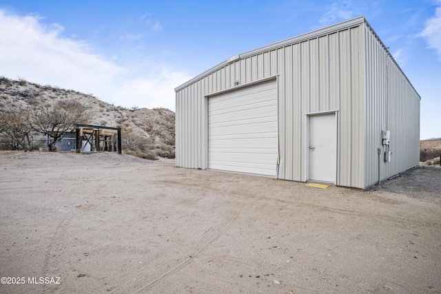 detached garage featuring driveway