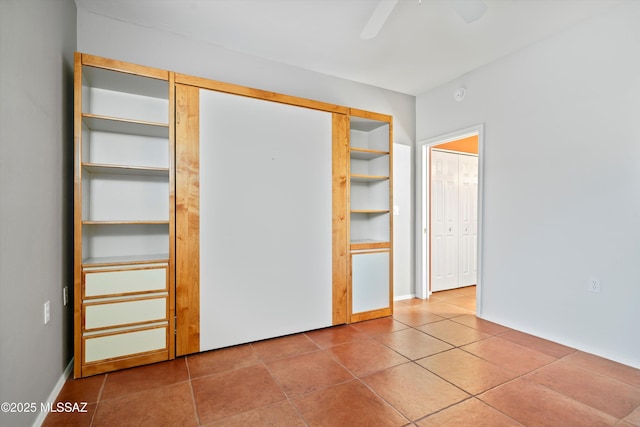 unfurnished bedroom with tile patterned flooring