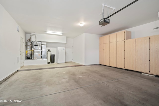 garage with heating unit, baseboards, gas water heater, and a garage door opener