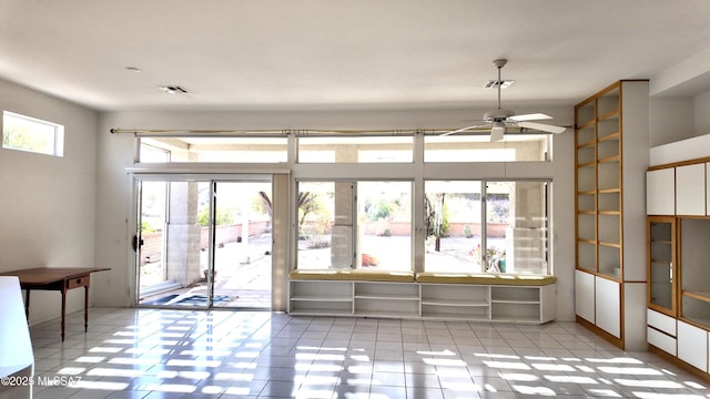 interior space with plenty of natural light, visible vents, and tile patterned floors