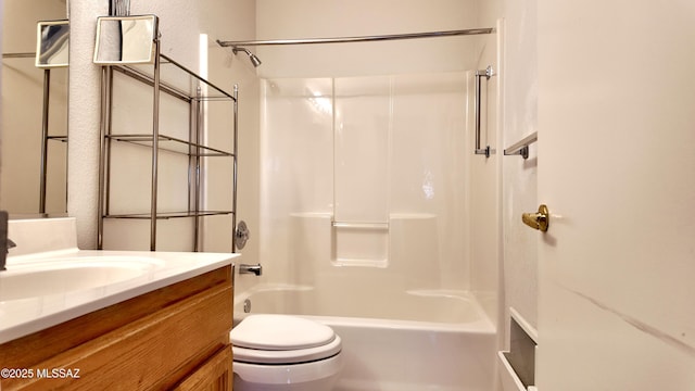 bathroom with shower / bathing tub combination, vanity, and toilet