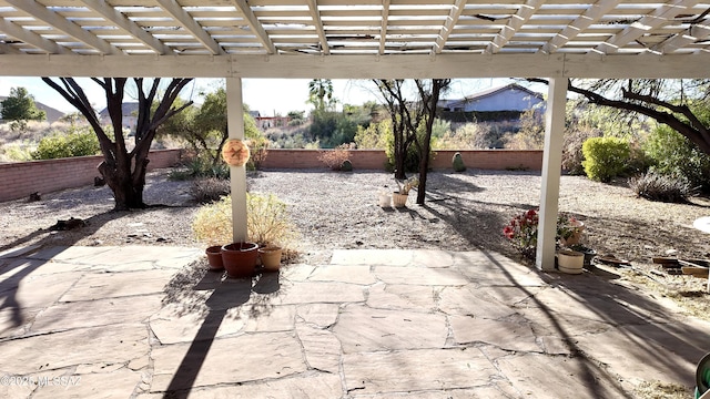 view of patio / terrace featuring a fenced backyard and a pergola