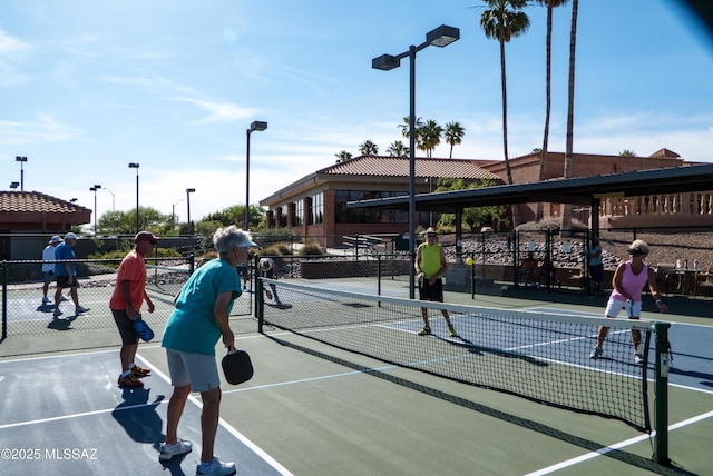 view of sport court with fence