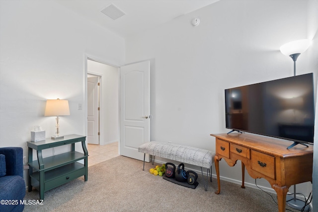 living room with visible vents, carpet flooring, and baseboards