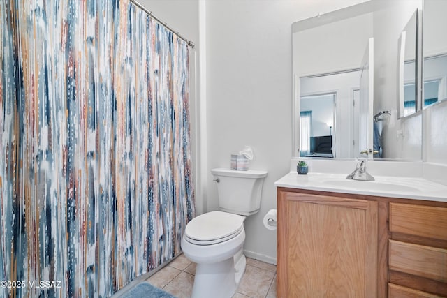 full bathroom featuring tile patterned floors, a shower with curtain, toilet, and vanity