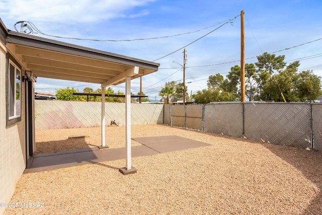 view of yard featuring a patio area and a fenced backyard