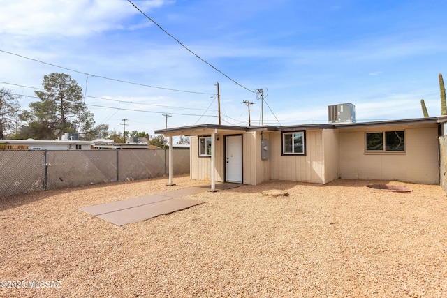 back of property featuring fence and central air condition unit