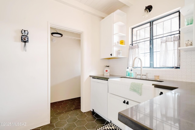 kitchen with open shelves, dark tile patterned flooring, white cabinets, dishwasher, and tasteful backsplash