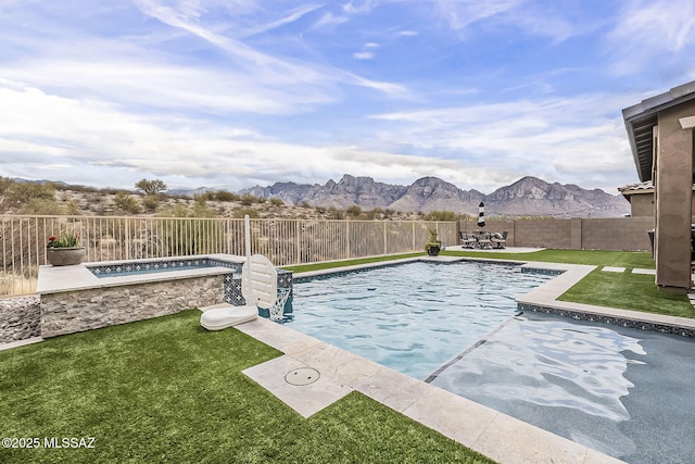 view of pool featuring a fenced backyard, a mountain view, a jacuzzi, a lawn, and a fenced in pool