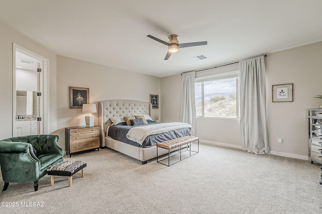 bedroom featuring light carpet, baseboards, visible vents, connected bathroom, and ceiling fan