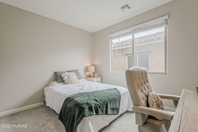 bedroom featuring carpet floors, visible vents, and baseboards